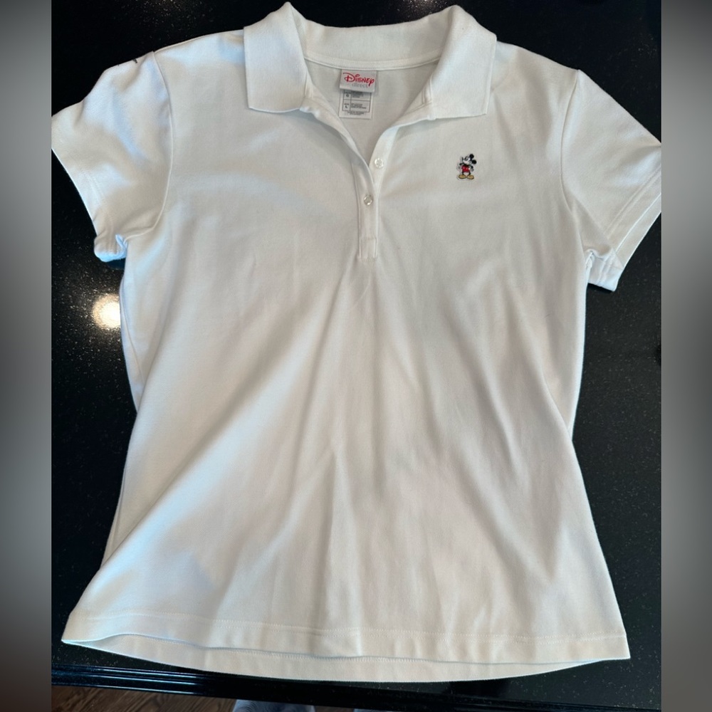 Disney women’s polo style white shirt with Mickey Mouse decal. Size large.